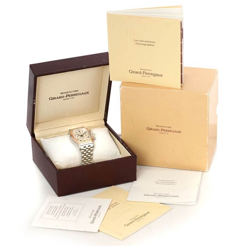 The Girard Perregaux Richeville Chronograph Steel and Rose Gold Watch 2710 is shown in its original box with accompanying booklets.