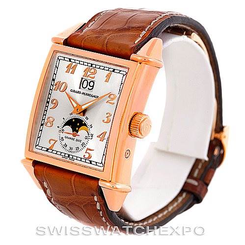 The image shows a Girard Perregaux Big Date Moon Phase 18K Rose Gold Watch 2580 model by Girard-Perregaux 25882-52-121-BB6B Men's Rose Gold Silver Dial 25882-52-121-BB6B Men's Rose Gold Silver Dial at a three-quarter angle, highlighting the face, case, crown, and leather strap.