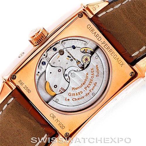 The image shows the back view of the Girard-Perregaux 25882-52-121-BB6B Men's Rose Gold Silver Dial 25882-52-121-BB6B Men's Rose Gold Silver Dial Big Date Moon Phase 18K Rose Gold Watch 2580, displaying its movement and engravings.