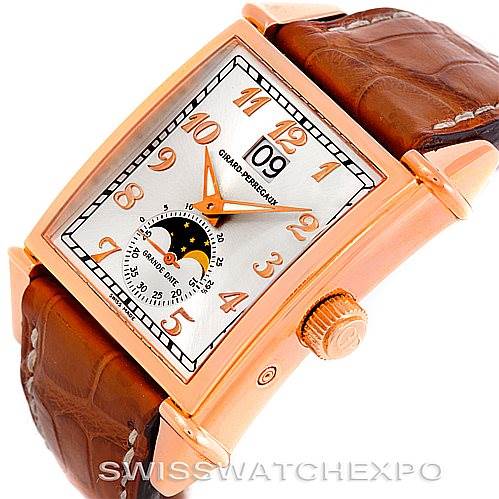 This image shows an angled view of the dial, crown, and part of the strap of the Girard-Perregaux 25882-52-121-BB6B Men's Rose Gold Silver Dial 25882-52-121-BB6B Men's Rose Gold Silver Dial Big Date Moon Phase 18K Rose Gold Watch 2580 model.