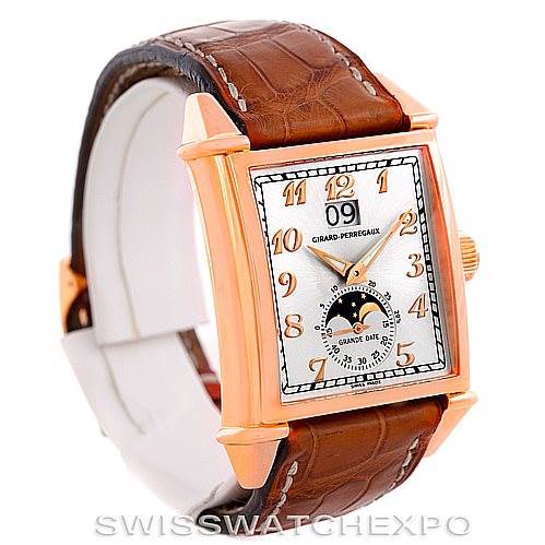 The image shows a Girard Perregaux Big Date Moon Phase 18K Rose Gold Watch 2580 model angled to display the dial and brown leather strap.