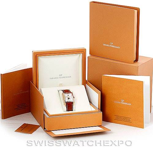 The image shows a Girard Perregaux Big Date Moon Phase 18K Rose Gold Watch 2580, displayed inside its box with accompanying accessories and manuals.