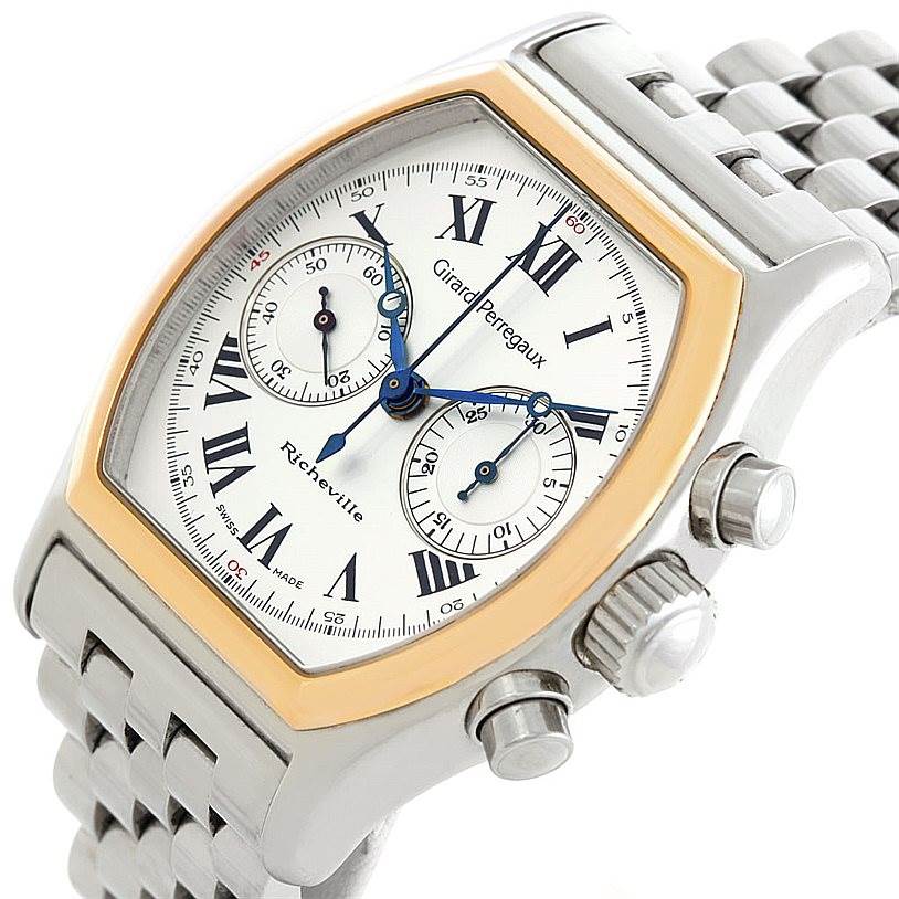 The Girard Perregaux Richeville Steel and Rose Gold 2710 watch is shown at a slight angle, highlighting its face, bezel, and partial bracelet.