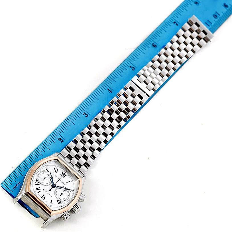 The image shows a top-down view of a Girard-Perregaux 2710 Men's Stainless Steel Silver Dial 2710 Men's Stainless Steel Silver Dial Richeville Steel and Rose Gold Watch 2710 model, alongside a ruler for size reference.