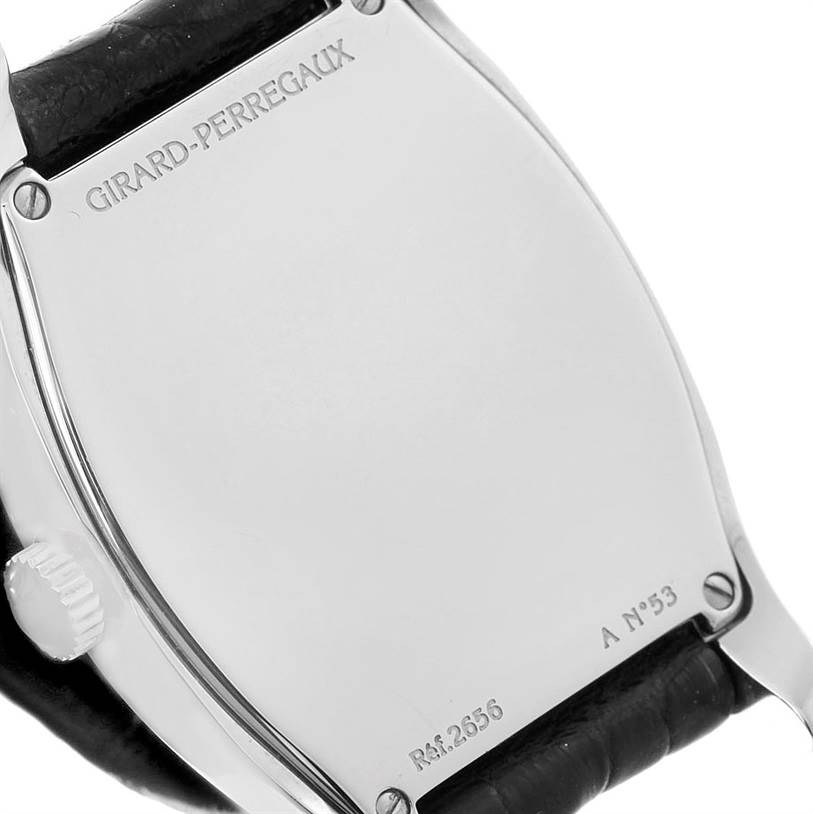 This image shows the back case of the Girard-Perregaux 2656 Women's Stainless Steel Silver Dial 2656 Women's Stainless Steel Silver Dial 2656 model, displaying engravings and part of the black leather strap.
