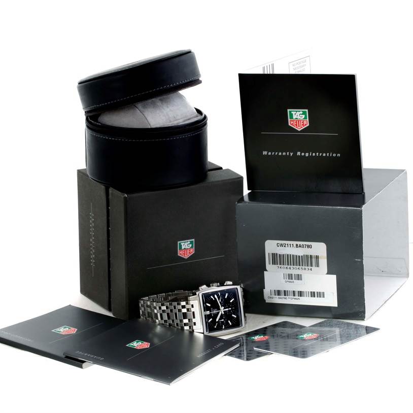 The image shows a Tag Heuer Monaco CW2111.BA0780 Men's Stainless Steel Black Dial CW2111.BA0780 Men's Stainless Steel Black Dial watch with its case, packaging, and warranty registration documents.