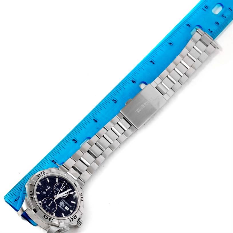 The image shows a Tag Heuer Aquaracer CAP2110.BA0833 Men's Stainless Steel Black Dial CAP2110.BA0833 Men's Stainless Steel Black Dial watch laid flat with a blue ruler measuring its length.