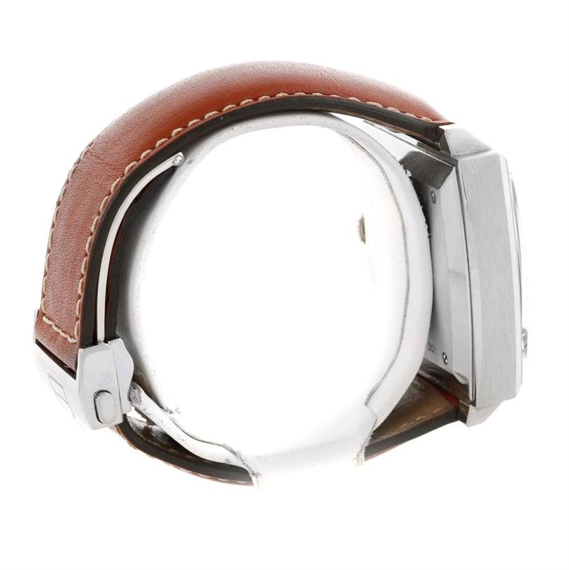 This image shows a side view of a Tag Heuer Monaco CW2111 Men's Stainless Steel Black Dial CW2111 Men's Stainless Steel Black Dial watch, highlighting the case and brown leather strap with stitching.