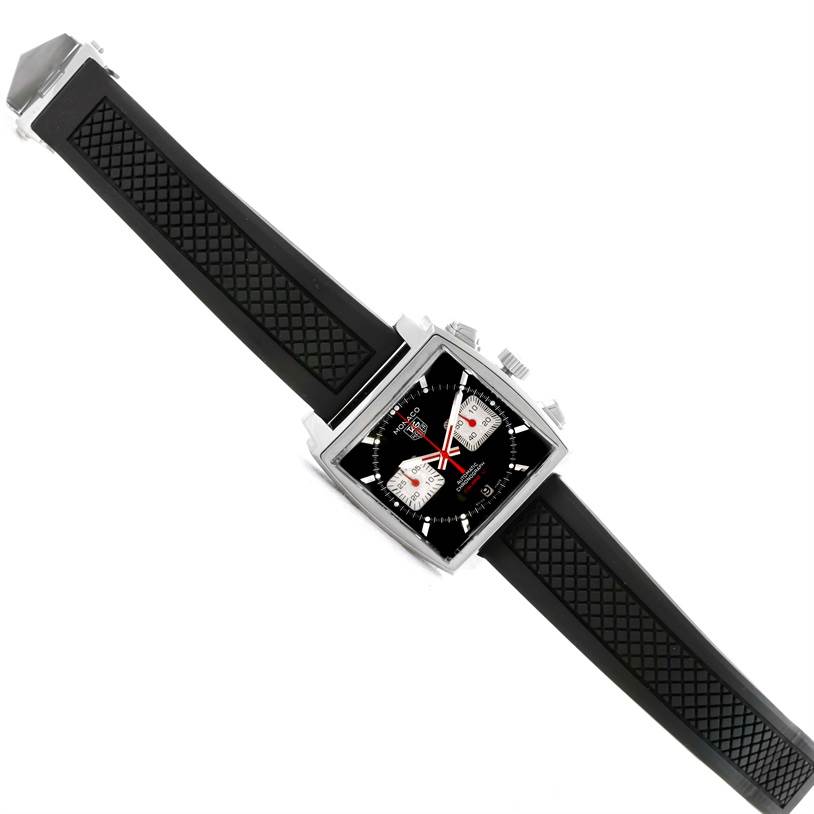 The image shows a top view of a Tag Heuer Monaco CAW2114 Men's Stainless Steel Black Dial CAW2114 Men's Stainless Steel Black Dial watch with a large square face and a black strap.