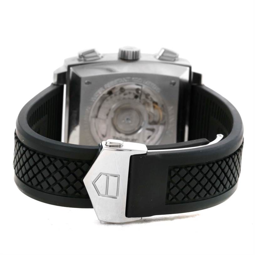 The image shows the back view of a Tag Heuer Monaco CAW2114 Men's Stainless Steel Black Dial CAW2114 Men's Stainless Steel Black Dial watch, highlighting the clasp and rubber strap.
