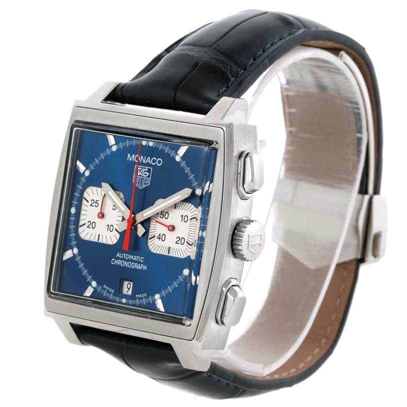 The image shows the front and side angle of the square-faced Tag Heuer Monaco CW2113 Men's Stainless Steel Blue Dial CW2113 Men's Stainless Steel Blue Dial watch, featuring its blue dial, chronograph, and black strap.