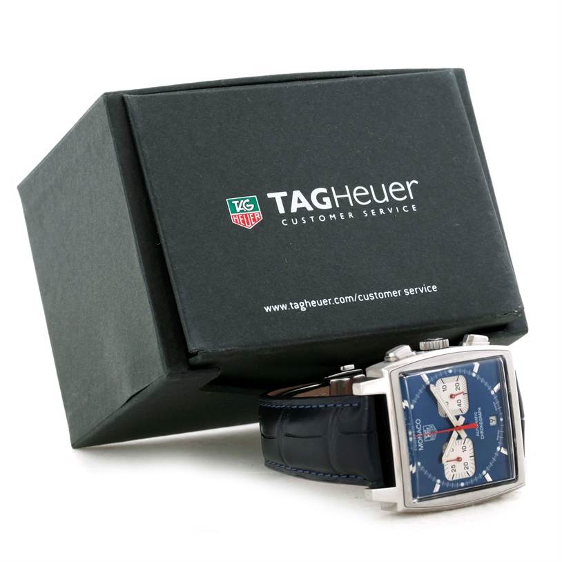 The image shows the front and side angles of the Tag Heuer Monaco CW2113 Men's Stainless Steel Blue Dial CW2113 Men's Stainless Steel Blue Dial watch, along with its box.