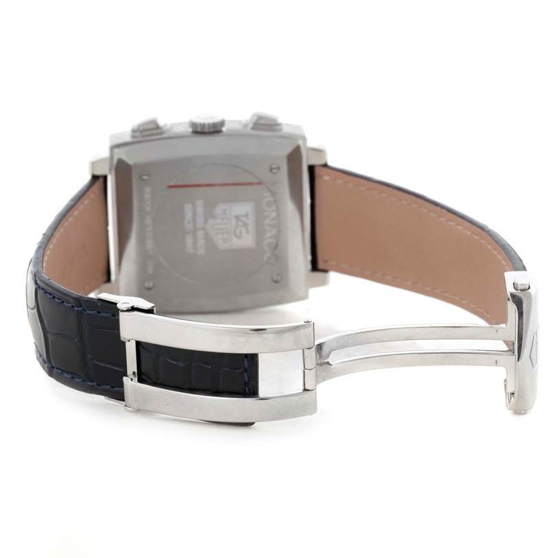 The image shows the back view of a Tag Heuer Monaco CW2113 Men's Stainless Steel Blue Dial CW2113 Men's Stainless Steel Blue Dial watch displaying its clasp, leather strap, and case back.