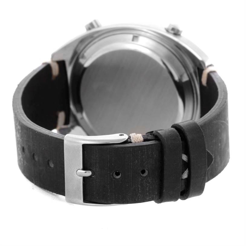 The image shows the back case and buckle of a Tag Heuer Autavia 1163 Men's Stainless Steel Black Dial 1163 Men's Stainless Steel Black Dial watch, focusing on the strap and clasp.