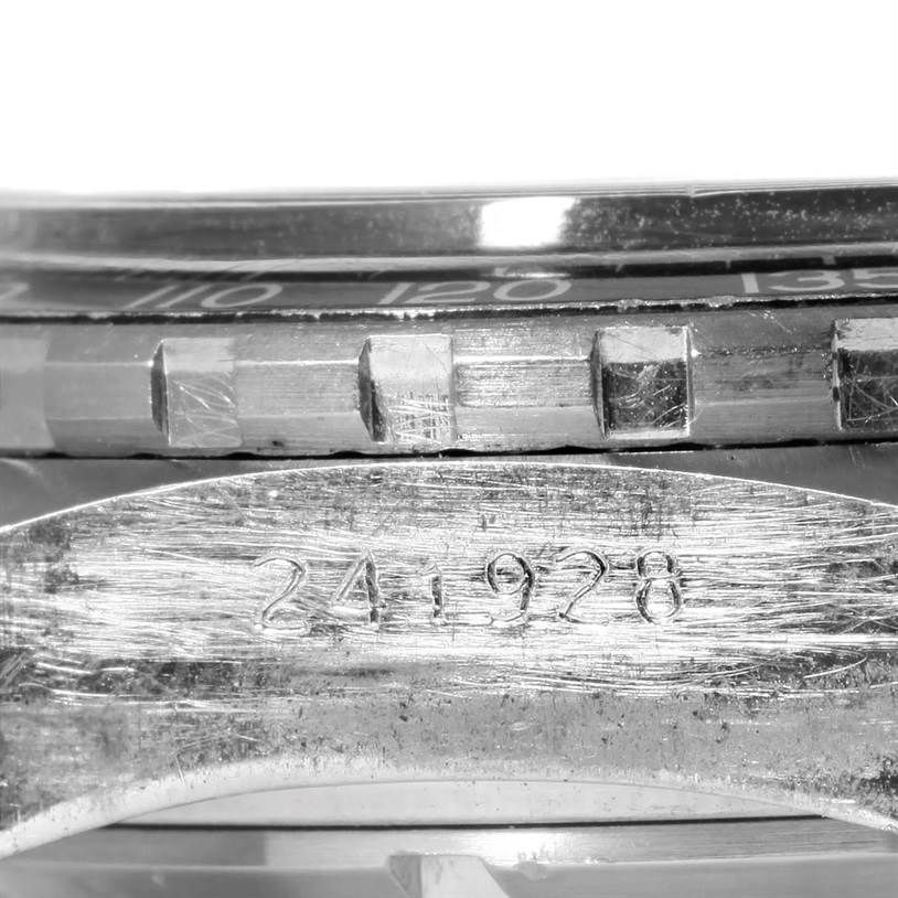 This image shows a close-up of the case side and bezel of a Tag Heuer Autavia 1163 Men's Stainless Steel Black Dial 1163 Men's Stainless Steel Black Dial watch, including the serial number (241928).