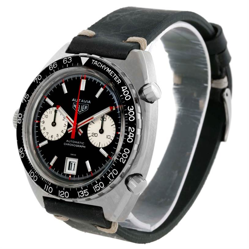 The image shows a Tag Heuer Autavia 1163 Men's Stainless Steel Black Dial 1163 Men's Stainless Steel Black Dial model watch at a three-quarter view, highlighting its dial, bezel, and strap.