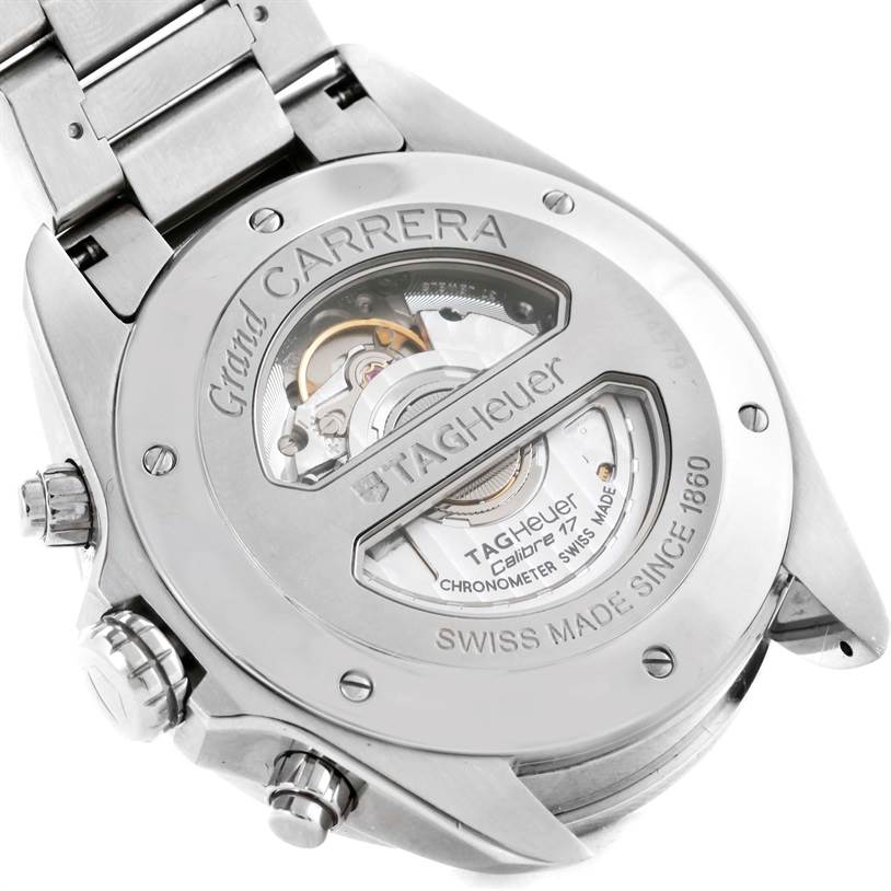 The image shows the back of a Tag Heuer Carrera CAV511B Men
s Stainless Steel Silver Dial CAV511B Men
s Stainless Steel Silver Dial watch, revealing the inner mechanism with "Grand Carrera" and other engravings.