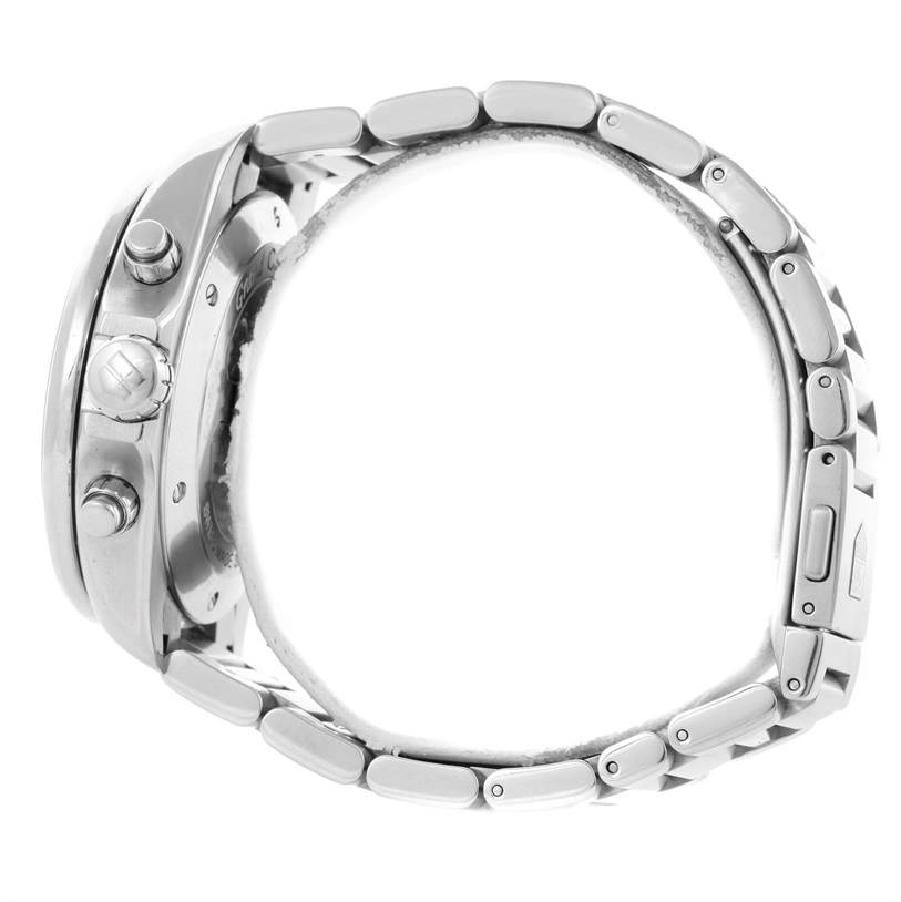 The image shows a side view of a Tag Heuer Carrera CAV511B Men
s Stainless Steel Silver Dial CAV511B Men
s Stainless Steel Silver Dial watch, highlighting its crown, pushers, and metal bracelet.