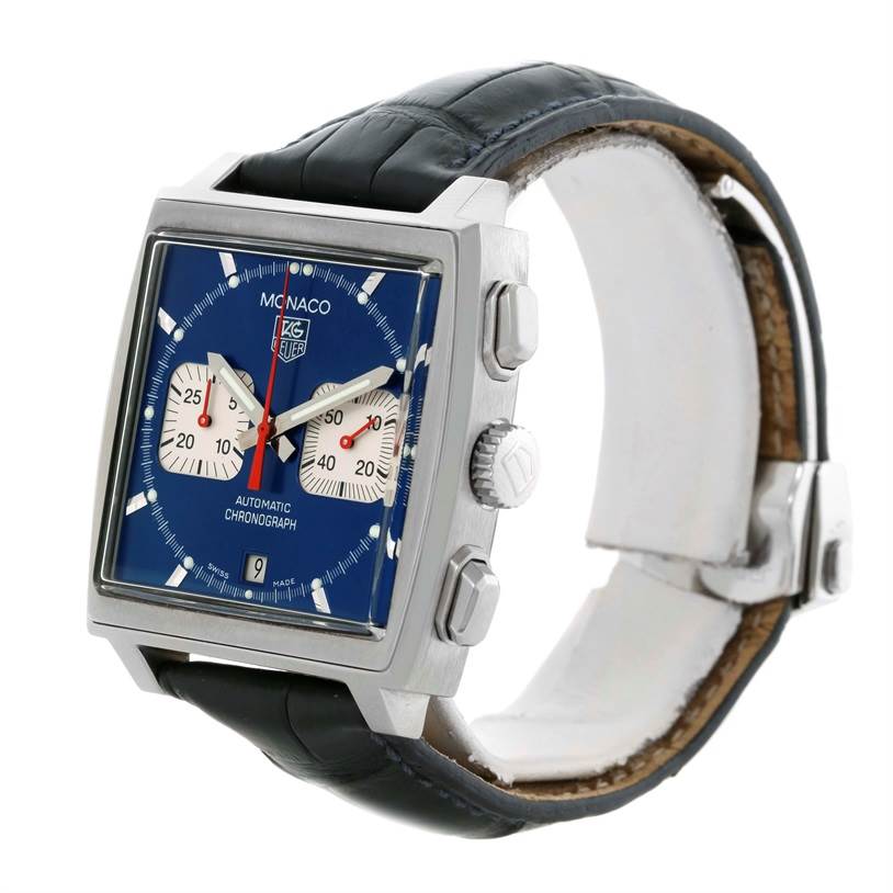 The image shows a Tag Heuer Monaco CW2113 Men's Stainless Steel Blue Dial CW2113 Men's Stainless Steel Blue Dial watch at a slight side angle, highlighting its square dial, crown, pushers, and leather strap.