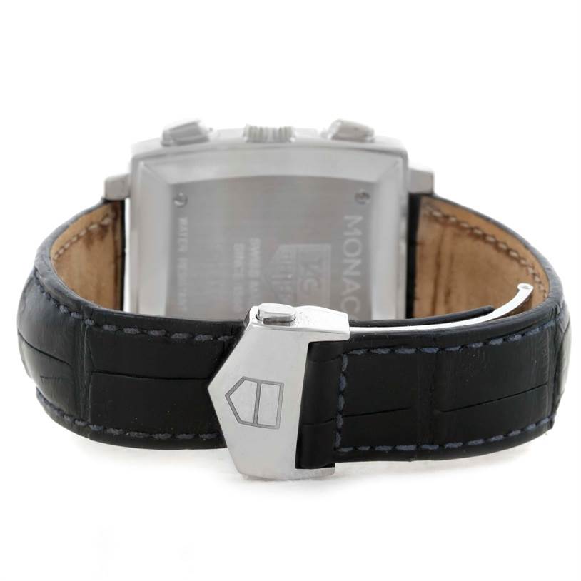 The image shows the back view of the Monaco model by Tag Heuer, focusing on the strap and clasp.