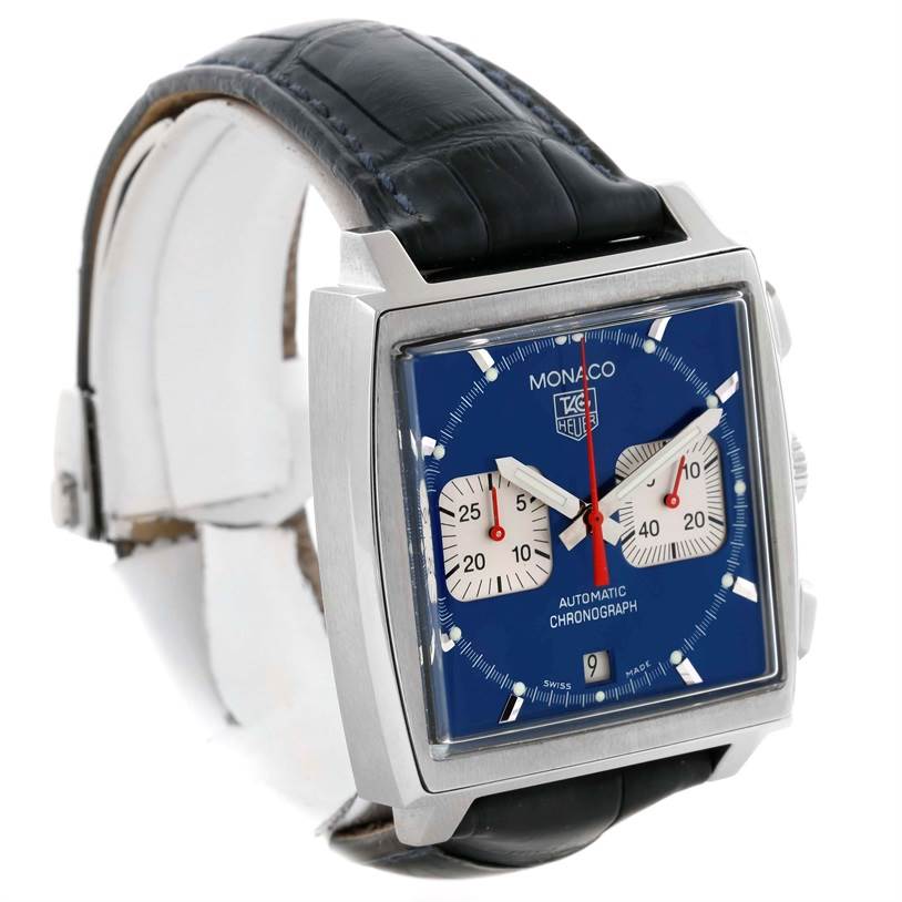 The image shows a Tag Heuer Monaco CW2113 Men's Stainless Steel Blue Dial CW2113 Men's Stainless Steel Blue Dial watch at a three-quarter angle, highlighting its blue dial, square case, and black leather strap.
