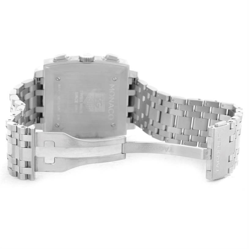 The image shows the back of a Tag Heuer Monaco CW2113 Men's Stainless Steel Blue Dial CW2113 Men's Stainless Steel Blue Dial watch, highlighting the case back and the open stainless steel bracelet.