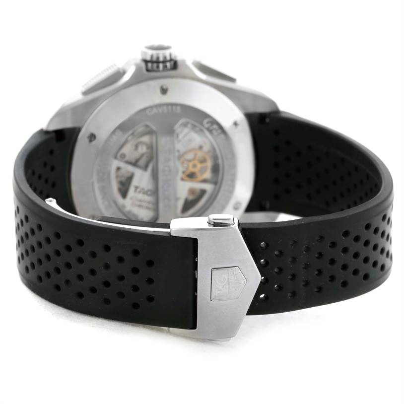 The image shows the back view of the Tag Heuer Carrera CAV5115 Men's Stainless Steel Black Dial CAV5115 Men's Stainless Steel Black Dial watch, focusing on its movement and perforated black strap.