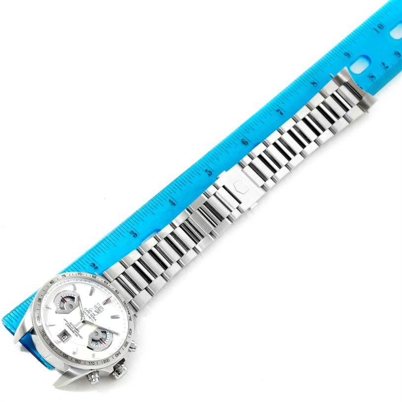 The image shows a Tag Heuer Carrera CAV511B Men's Stainless Steel Silver Dial CAV511B Men's Stainless Steel Silver Dial watch laid flat with a bracelet and a blue ruler for measurement.