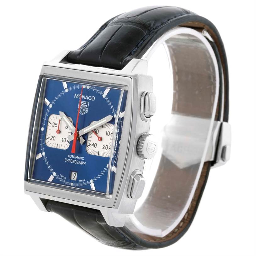 The image shows a Tag Heuer Monaco CW2113 Men
s Stainless Steel Blue Dial CW2113 Men
s Stainless Steel Blue Dial watch with a blue dial, two sub-dials, and a black leather strap from an angled side view.