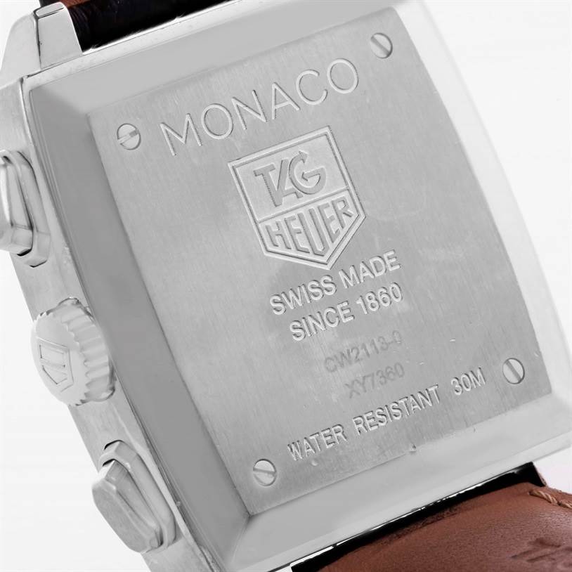 The image shows the back case of a Tag Heuer Monaco CW2113 Men
s Stainless Steel Blue Dial CW2113 Men
s Stainless Steel Blue Dial watch, highlighting the engraved details and the side pushers.