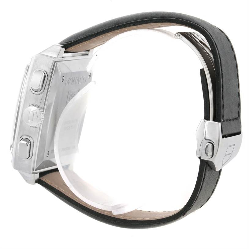 The image shows a side view of the Tag Heuer Monaco CW2111 Men's Stainless Steel Black Dial CW2111 Men's Stainless Steel Black Dial watch, highlighting the case back, buttons, and black leather strap.