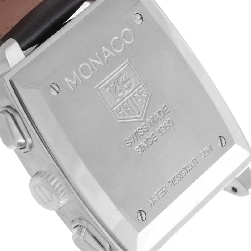 The image shows the back case of a Tag Heuer Monaco CW2111 Men's Stainless Steel Black Dial CW2111 Men's Stainless Steel Black Dial watch, including the engraved brand logo and specifications.