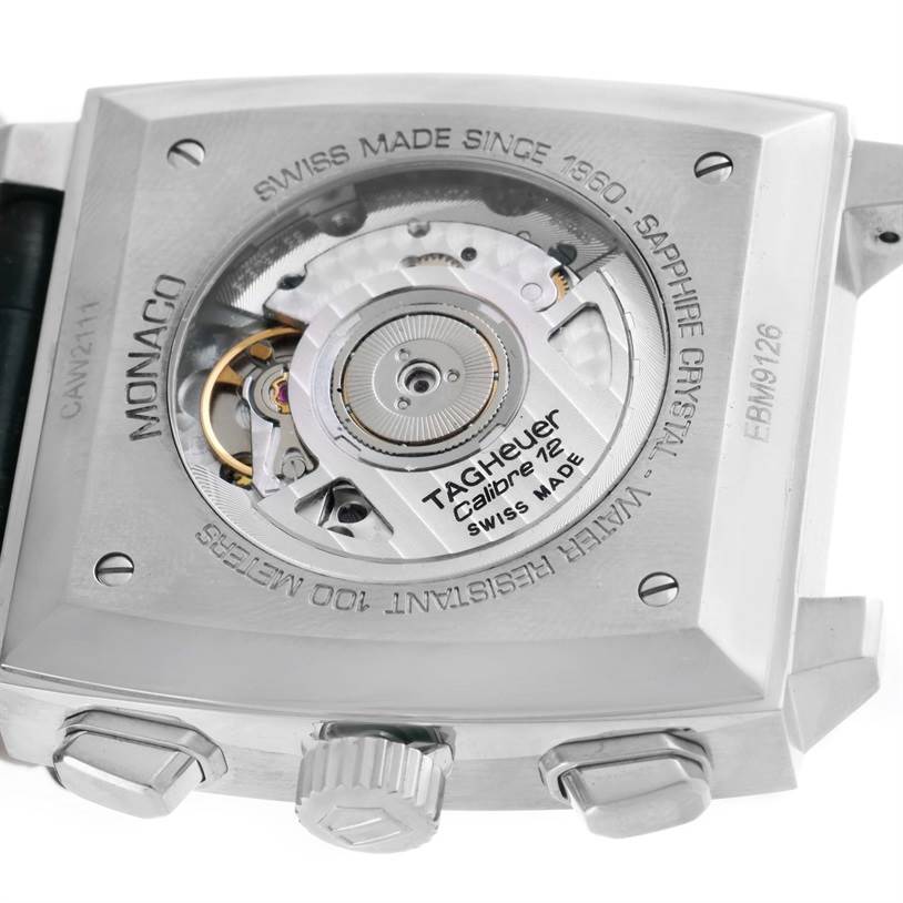 This image shows the case back of a Tag Heuer Monaco CAW2111 Men's Stainless Steel Blue Dial CAW2111 Men's Stainless Steel Blue Dial watch, highlighting the Calibre 12 movement through the sapphire crystal.