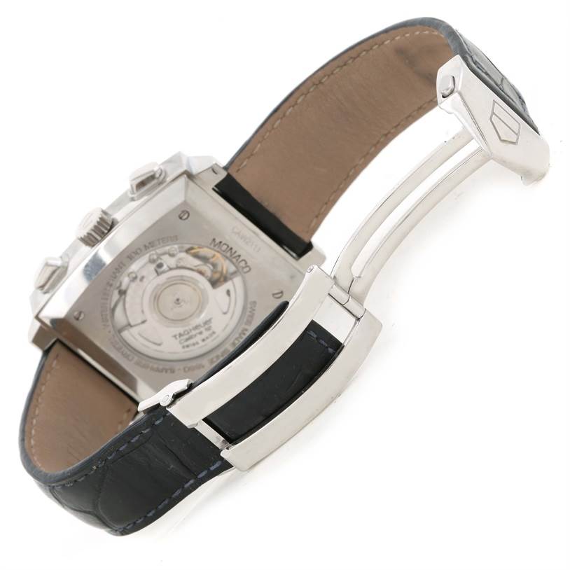 The image shows the back view of a Tag Heuer Monaco CAW2111 Men's Stainless Steel Blue Dial CAW2111 Men's Stainless Steel Blue Dial watch, highlighting its movement and deployment clasp with the strap partially open.