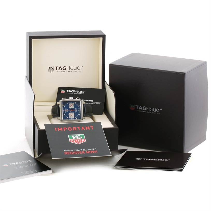 The image shows the Tag Heuer Monaco CAW2111 Men's Stainless Steel Blue Dial CAW2111 Men's Stainless Steel Blue Dial watch in its box with accompanying documents and an additional outer box.