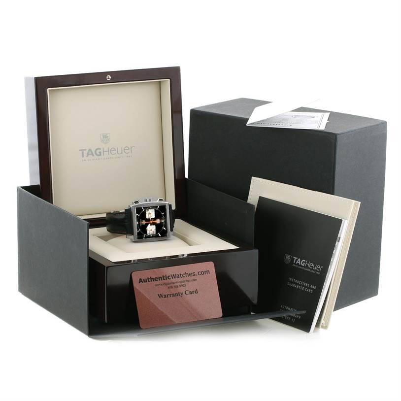 The image shows a Limited Edition Tag Heuer watch displayed in an open box with warranty card and instruction manuals.