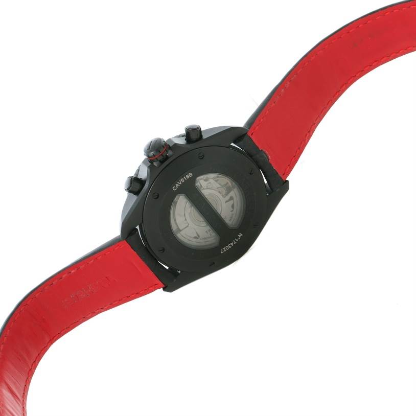This image shows the back case of a Tag Heuer Carrera CAV518B.FC6237 Men's Stainless Steel Black Dial CAV518B.FC6237 Men's Stainless Steel Black Dial watch with its red strap partially visible.
