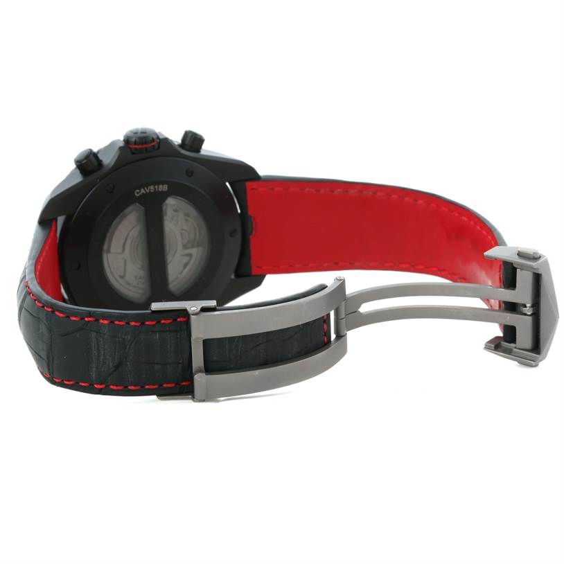 The image shows the back view of a Tag Heuer Carrera CAV518B.FC6237 Men's Stainless Steel Black Dial CAV518B.FC6237 Men's Stainless Steel Black Dial watch, highlighting its black case, red inner strap, and deployment clasp.