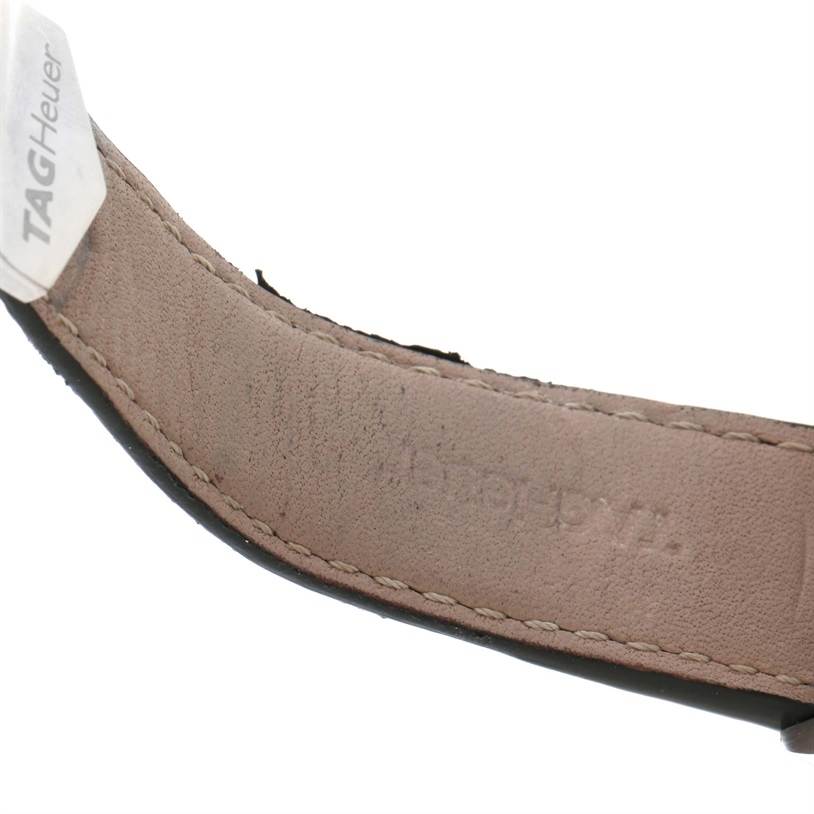 The image shows a close-up of the leather strap for a Tag Heuer Carrera CAV511A Men's Stainless Steel Black Dial CAV511A Men's Stainless Steel Black Dial watch, highlighting the stitching and brand logo.
