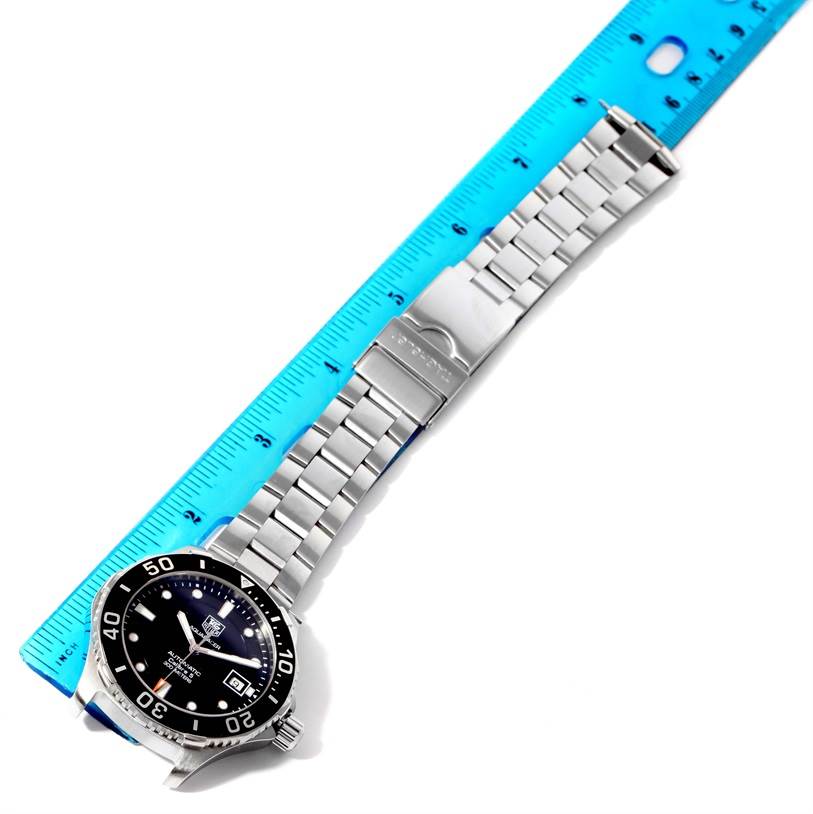 The image shows an overhead view of a Tag Heuer Aquaracer WAN2110.BA0822 Men's Stainless Steel Black Dial WAN2110.BA0822 Men's Stainless Steel Black Dial watch, displaying the watch face, bezel, and bracelet, measured against a blue ruler.