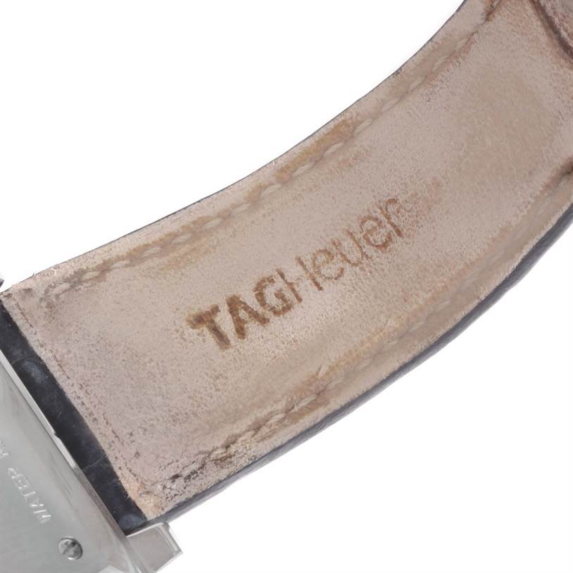 The image shows a close-up of the leather strap of a Tag Heuer Monaco CW2113 Men
s Stainless Steel Blue Dial CW2113 Men
s Stainless Steel Blue Dial watch, with the brand name visible on the inside.