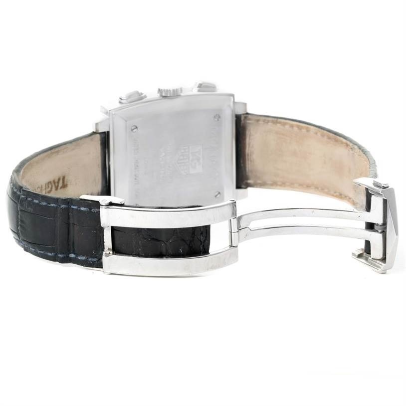 The image shows the back view of a Tag Heuer Monaco CW2113 Men
s Stainless Steel Blue Dial CW2113 Men
s Stainless Steel Blue Dial watch, including its leather strap and deployment clasp.