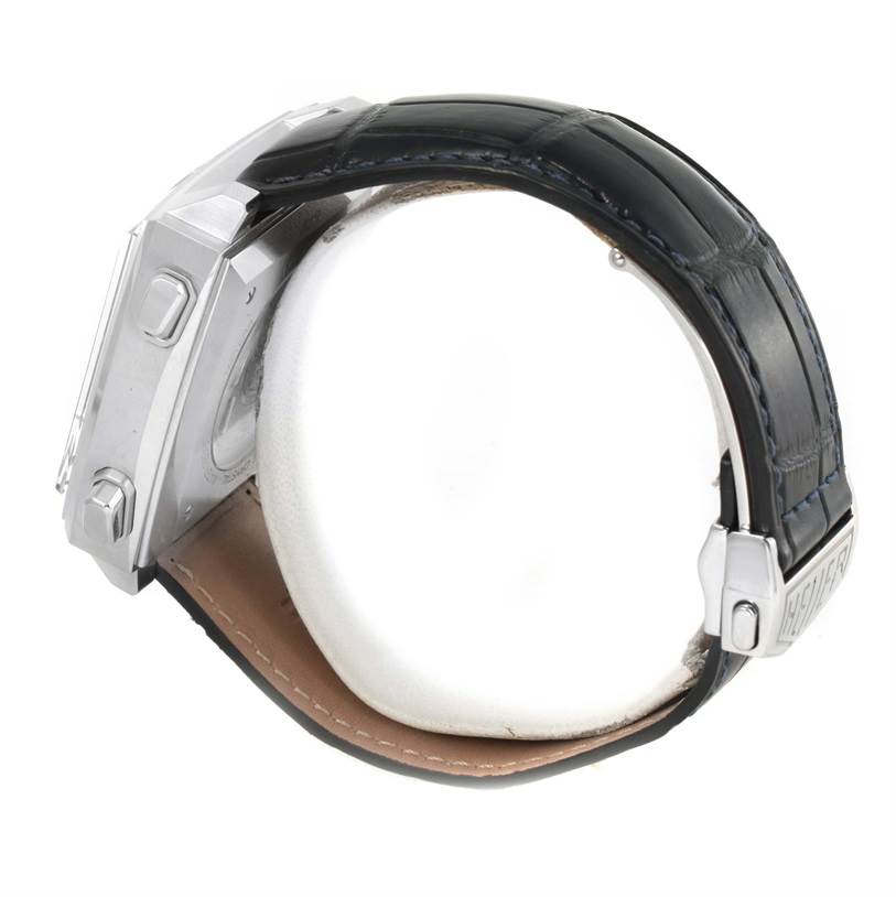 The image shows a side view of a Tag Heuer Monaco CAW211P Men's Stainless Steel Blue Dial CAW211P Men's Stainless Steel Blue Dial watch, highlighting its case, leather strap, and clasp.