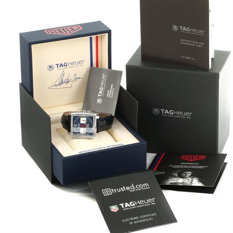 The Tag Heuer Monaco CAW211P Men's Stainless Steel Blue Dial CAW211P Men's Stainless Steel Blue Dial watch is shown in its open box along with manuals and certificates.