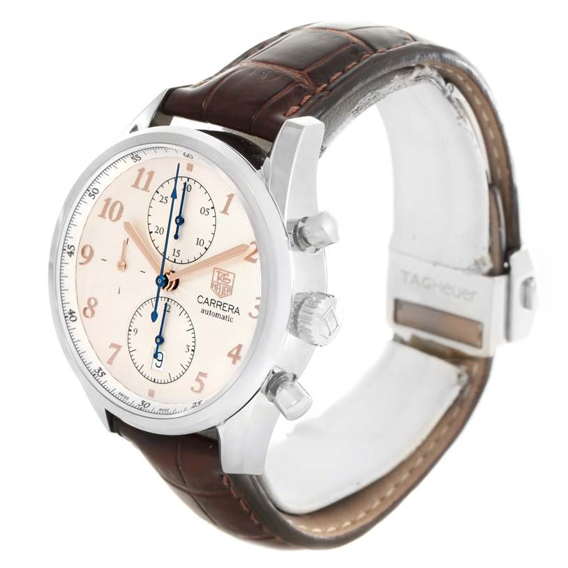 The image shows a Tag Heuer Carrera CAR221A.FC6353 Men
s Stainless Steel Silver Dial CAR221A.FC6353 Men
s Stainless Steel Silver Dial watch at a three-quarter angle, highlighting its dial, chronograph buttons, and leather strap.