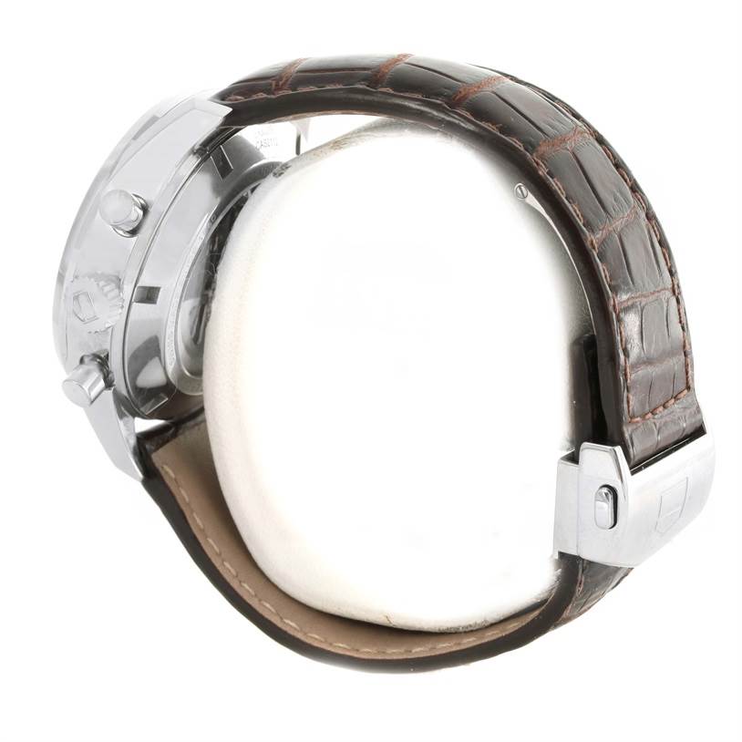 The image shows a side view of a Tag Heuer Carrera CAR221A.FC6353 Men
s Stainless Steel Silver Dial CAR221A.FC6353 Men
s Stainless Steel Silver Dial watch highlighting the case, crown, and leather strap with a clasp.