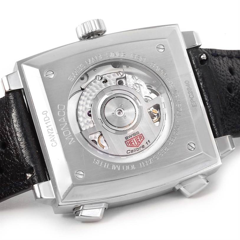 The image shows the backside of the Tag Heuer Monaco Limited Edition watch, featuring the Calibre 11 movement and leather strap.