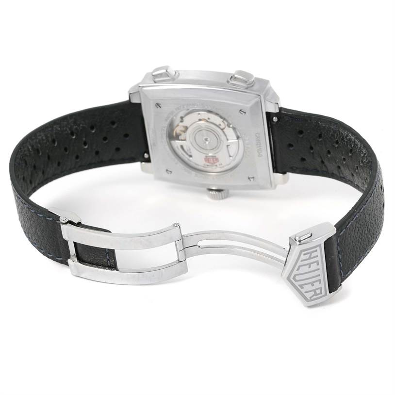 The image shows the back of the Tag Heuer Limited Edition CAW211D Men's Stainless Steel Blue Dial CAW211D Men's Stainless Steel Blue Dial watch, focusing on the caseback, movement, and partially opened clasp.