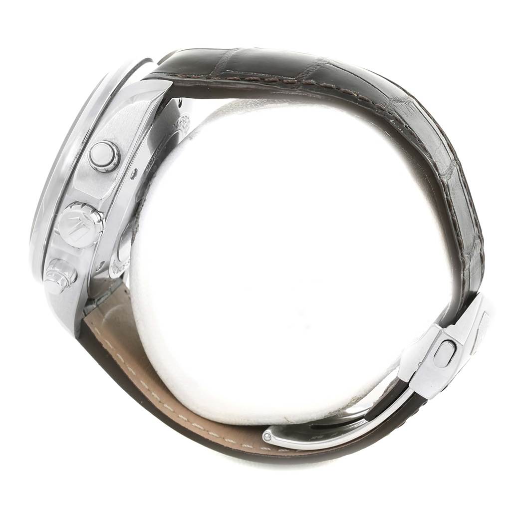 The image shows a side angle of the Tag Heuer Carrera CAV511A.FC6225 Men's Stainless Steel Black Dial CAV511A.FC6225 Men's Stainless Steel Black Dial watch, featuring its case, pushers, crown, and part of the leather strap and clasp.