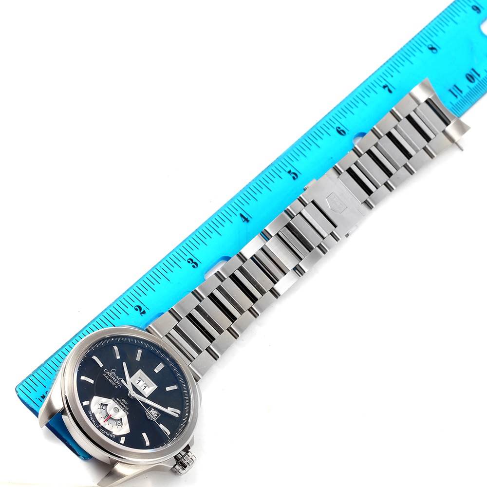 The image shows a Tag Heuer Carrera WAV5111 Men's Stainless Steel Black Dial WAV5111 Men's Stainless Steel Black Dial watch and its metal bracelet, next to a blue ruler for size reference.